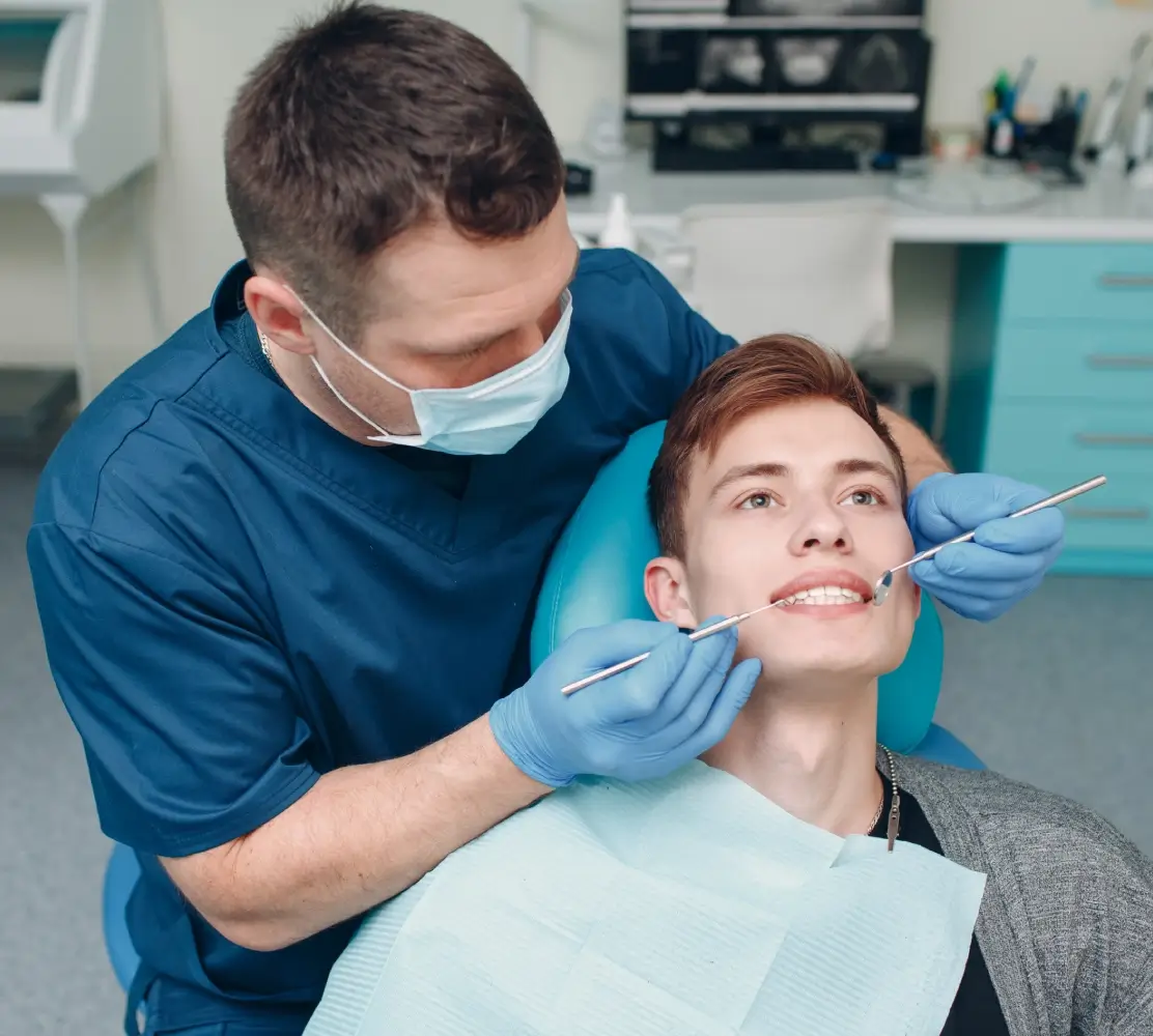 Dentist examining a patient's teeth.